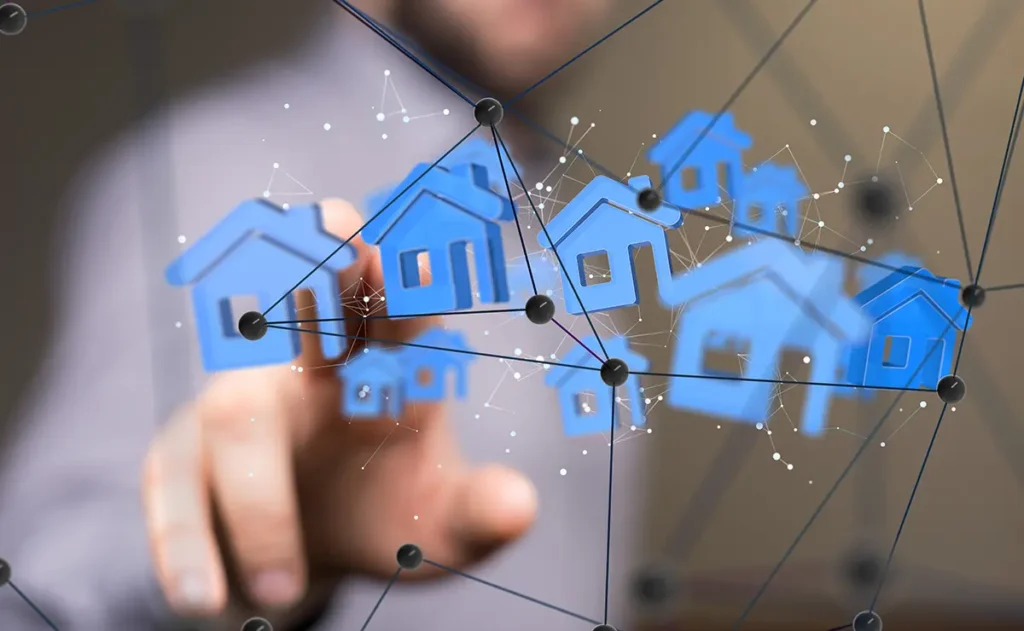 Cyber security specialist pointing at a graph of house icons connected with nodes